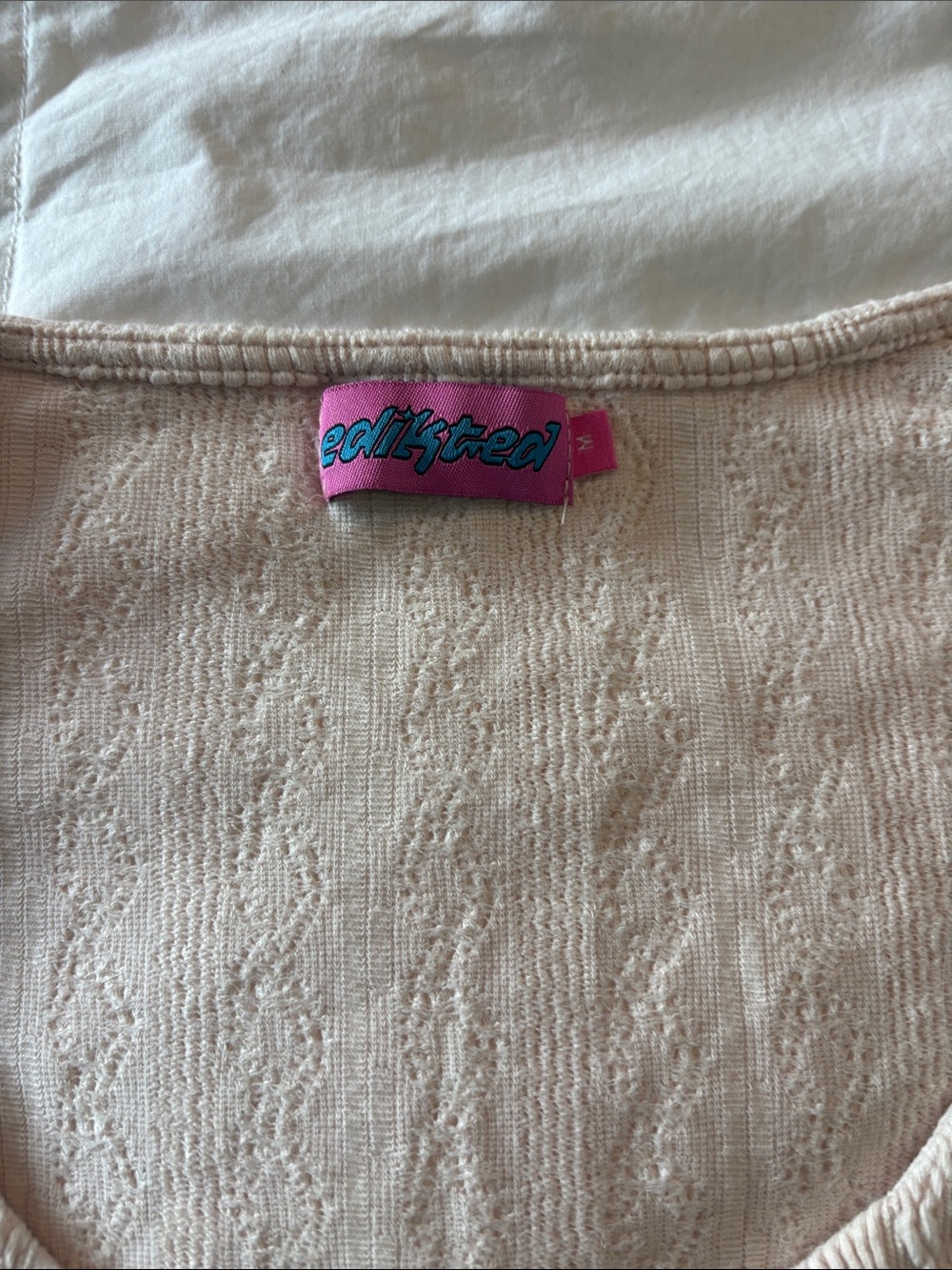 Edikted Cream Knit Crop Top with Pink Logo Tag